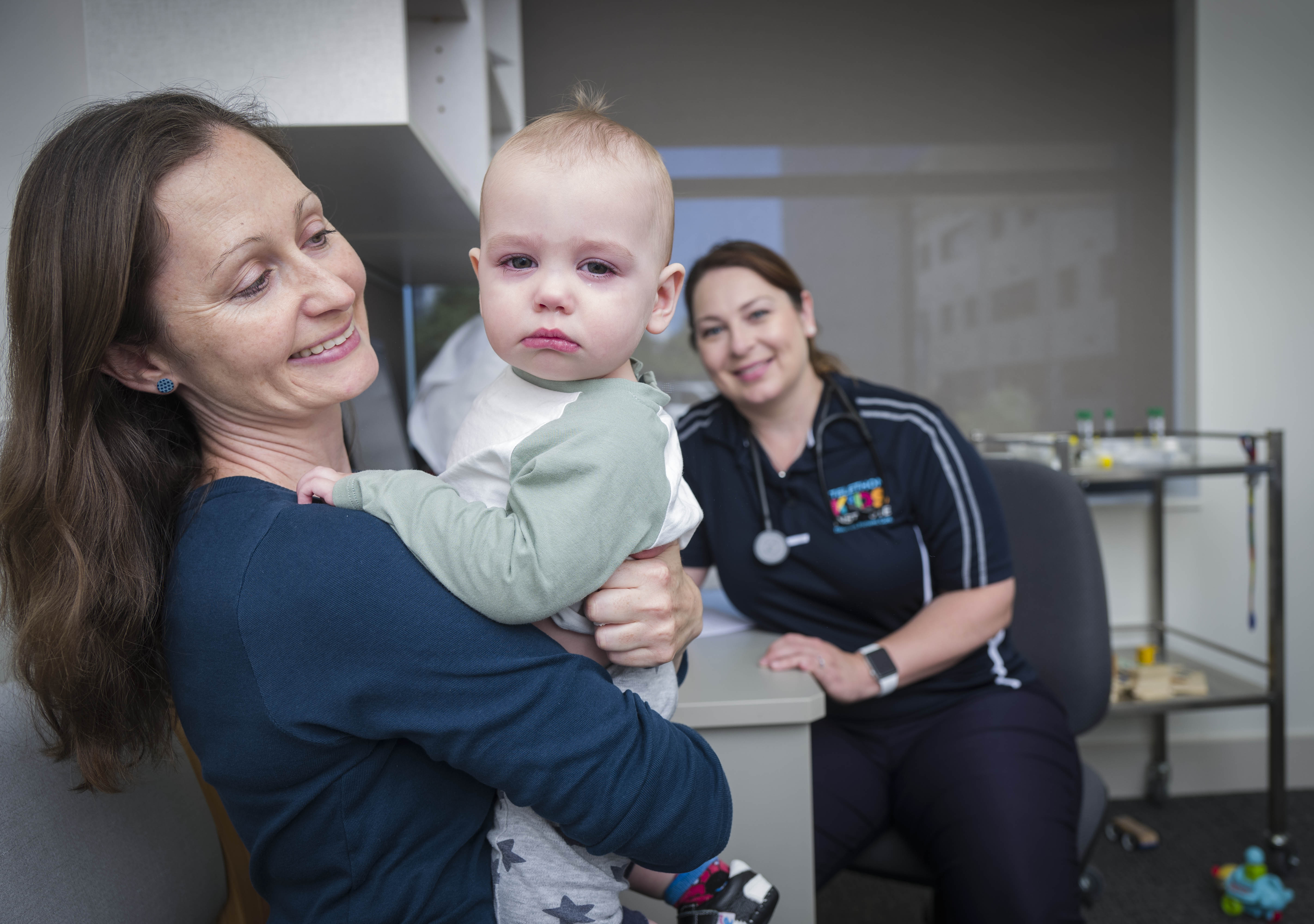 •	ORIGINS Paediatrician, Dr Katie Britton, with one-year-old ORIGINS participant, Samuel Barnett, and mother, Anna Callan. 