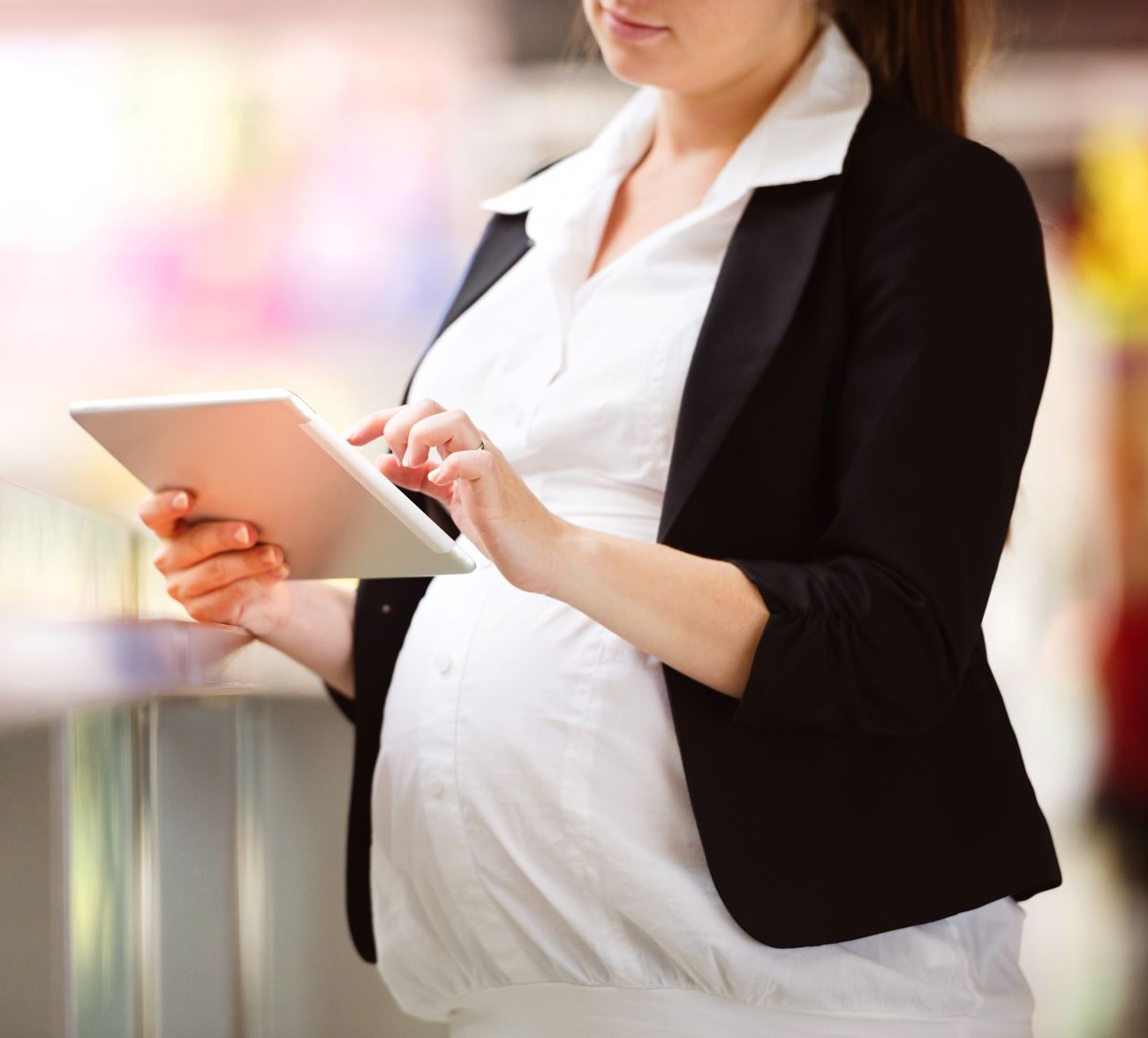 Pregnant belly with tablet